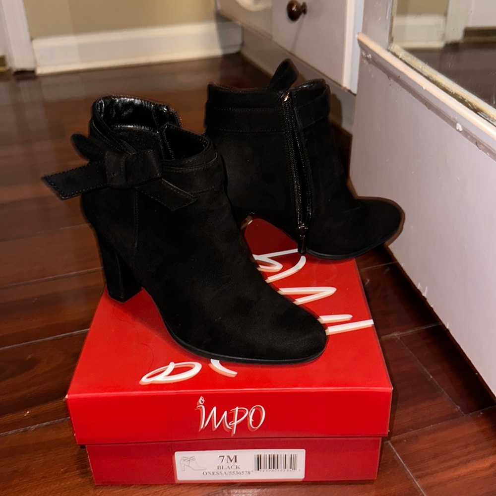 Black booties with bow. Excellent condo on - worn 1 time
